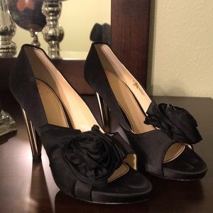 Black, gold heel shoes